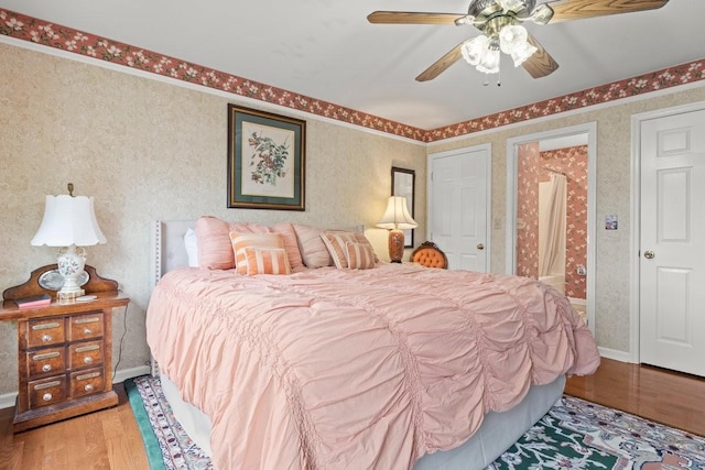 bedroom with ceiling fan and light wood-type flooring