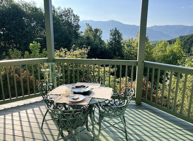 wooden deck featuring a mountain view