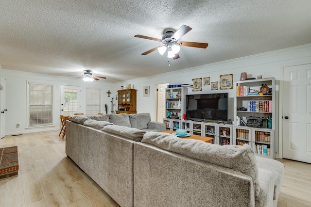 living room with ornamental molding, a textured ceiling, ceiling fan, and light hardwood / wood-style flooring