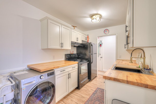 kitchen featuring washer / clothes dryer, sink, wooden counters, and electric range