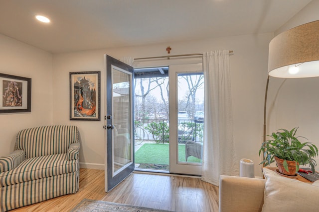 doorway to outside with light hardwood / wood-style floors