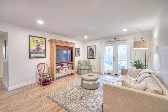 living room featuring hardwood / wood-style flooring and french doors