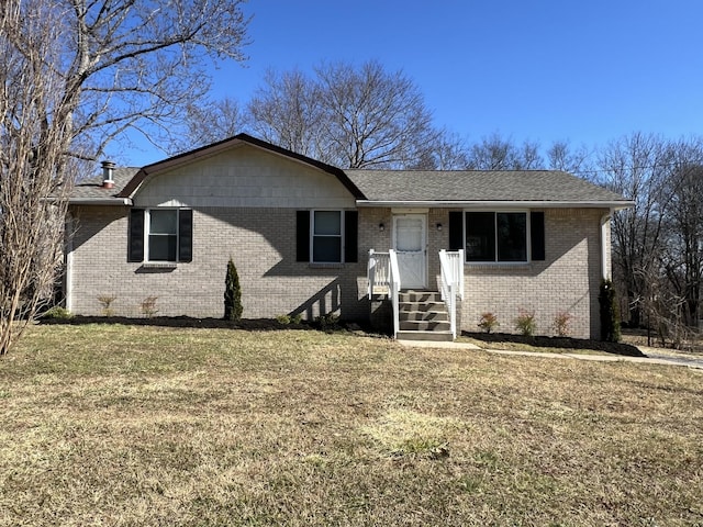 single story home with a front yard