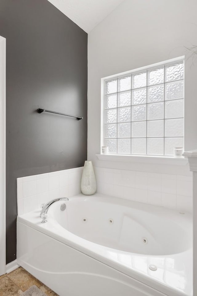 bathroom featuring a washtub