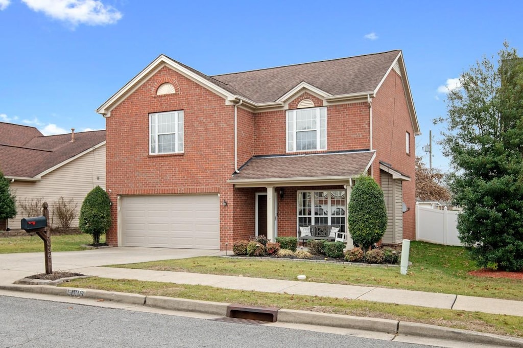 view of front facade with a garage and a front yard