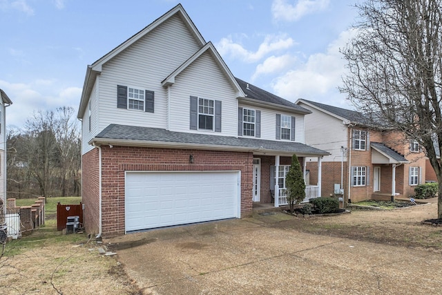 front of property featuring a garage and covered porch