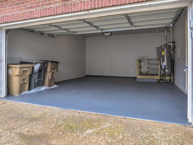 garage with a garage door opener and gas water heater