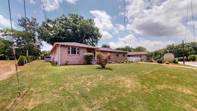 single story home featuring a front lawn