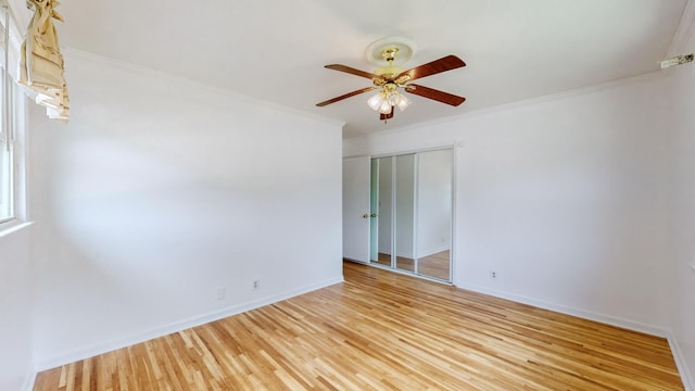 unfurnished room featuring ornamental molding, ceiling fan, and light hardwood / wood-style floors