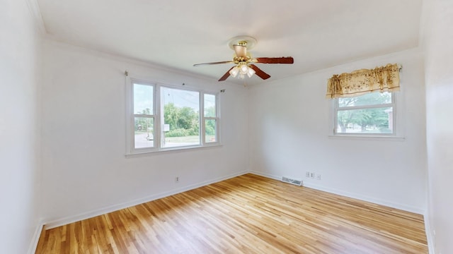 unfurnished room with ceiling fan, a healthy amount of sunlight, and light hardwood / wood-style floors