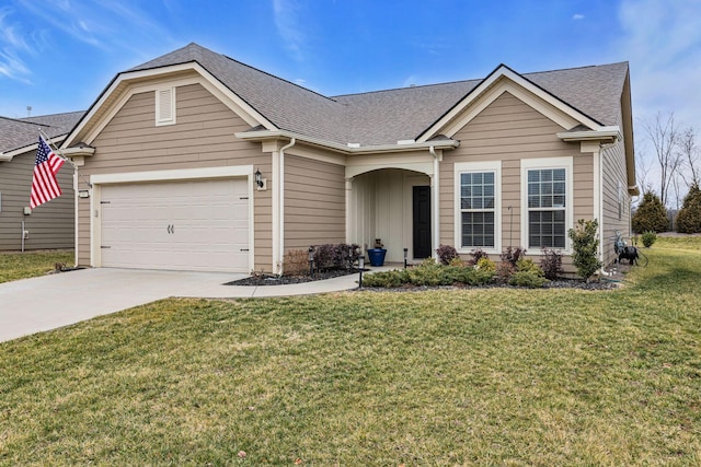 view of front facade with a garage and a front yard