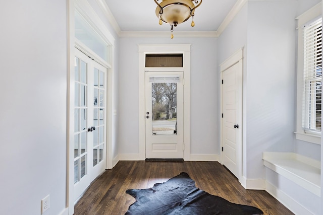 foyer entrance with crown molding, dark hardwood / wood-style flooring, and french doors