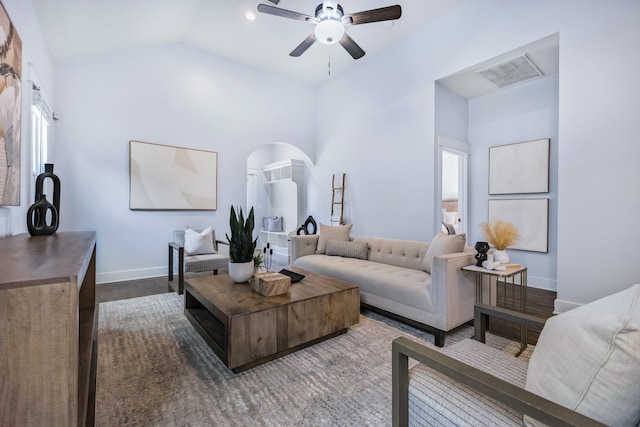 living room featuring lofted ceiling, hardwood / wood-style floors, and ceiling fan