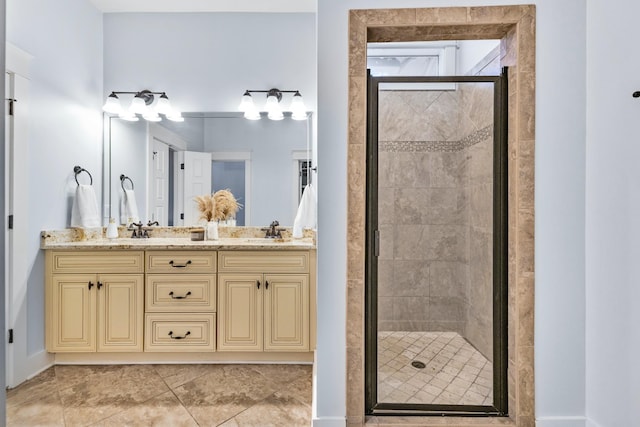 bathroom featuring vanity and a shower with shower door