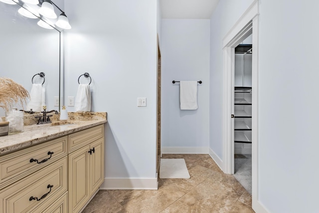 bathroom with vanity and tile patterned flooring