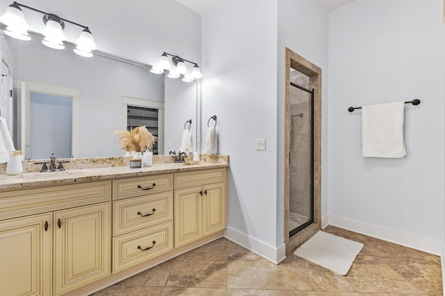 bathroom featuring walk in shower and vanity