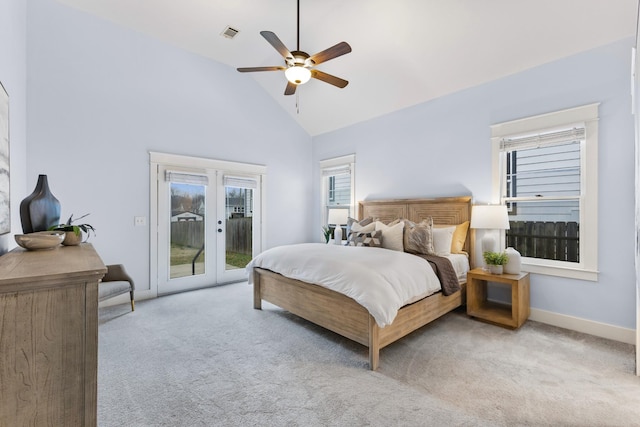 bedroom featuring high vaulted ceiling, access to exterior, ceiling fan, light carpet, and french doors