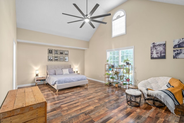 bedroom featuring multiple windows, ceiling fan, dark hardwood / wood-style floors, and high vaulted ceiling