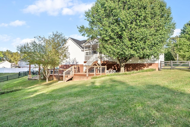 view of yard featuring a wooden deck