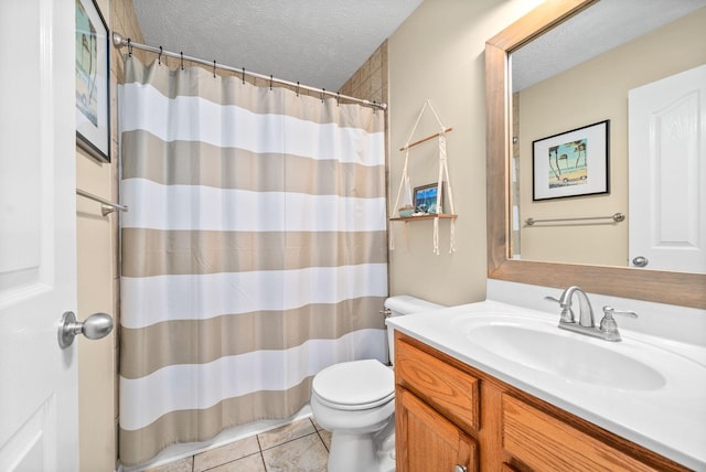 bathroom featuring vanity, a textured ceiling, a shower with curtain, tile patterned floors, and toilet