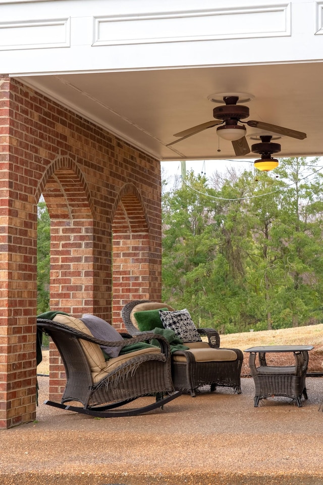 view of patio featuring ceiling fan