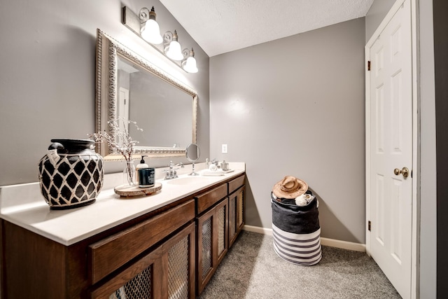 bathroom featuring vanity and a textured ceiling