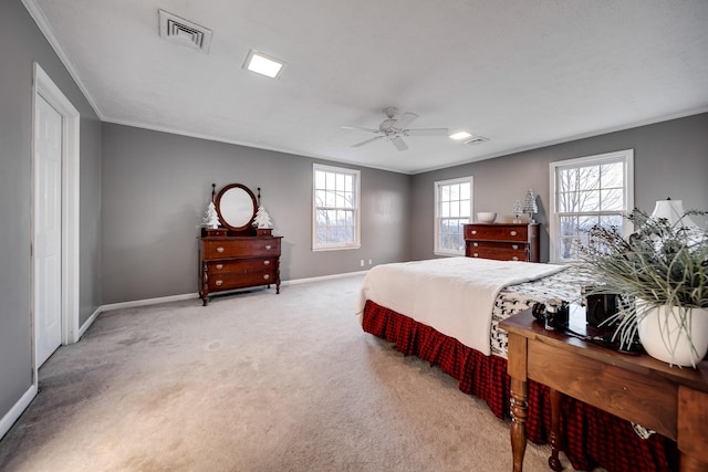 bedroom featuring ornamental molding, light carpet, and ceiling fan