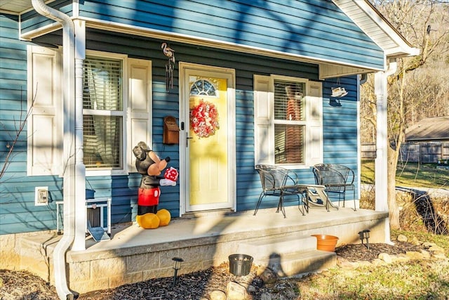 doorway to property featuring covered porch