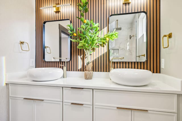 bathroom featuring vanity and an enclosed shower