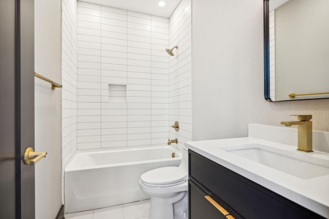 full bathroom featuring tile patterned floors, vanity, toilet, and tiled shower / bath combo