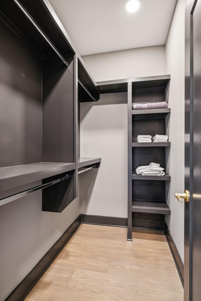 spacious closet featuring light wood-type flooring