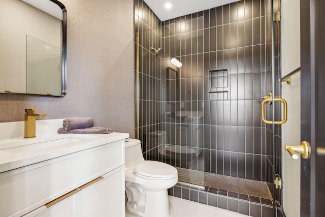 bathroom featuring walk in shower, vanity, and toilet