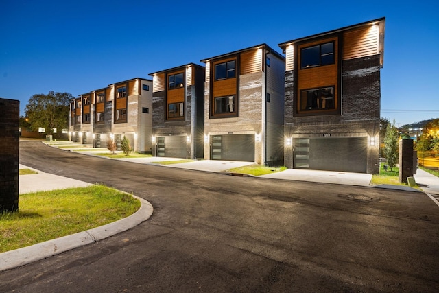 outdoor building at dusk with a garage