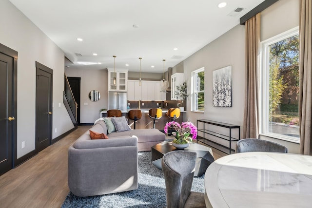 living room with dark hardwood / wood-style flooring