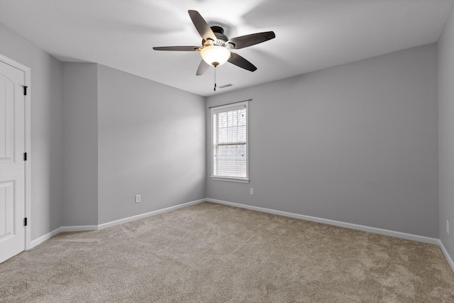 unfurnished room with light carpet and ceiling fan