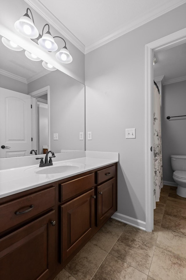 bathroom featuring crown molding, vanity, and toilet