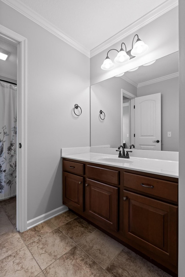 bathroom with vanity and ornamental molding