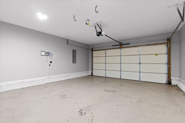 garage with a garage door opener and electric panel