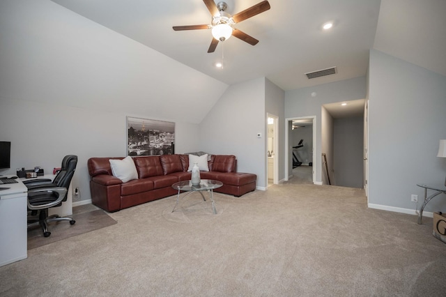 carpeted living room featuring ceiling fan and vaulted ceiling