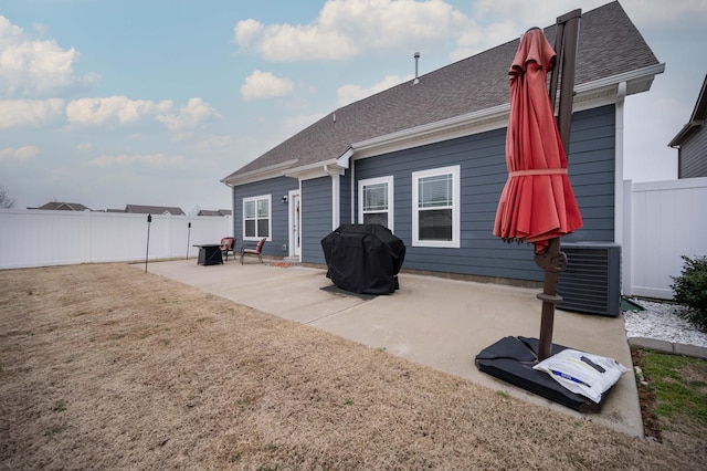 rear view of property with a patio and central air condition unit