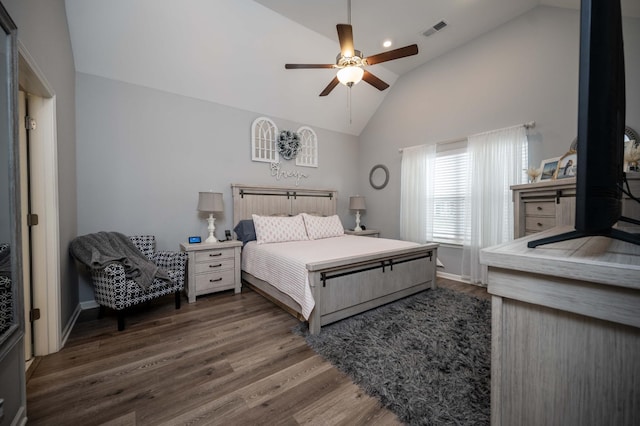 bedroom with high vaulted ceiling, dark hardwood / wood-style floors, and ceiling fan