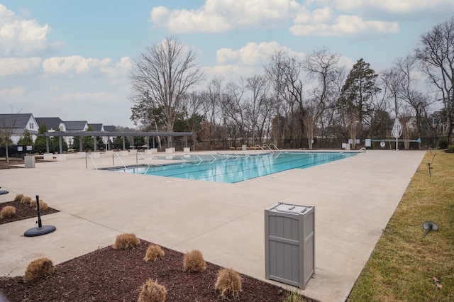 view of swimming pool with a patio area