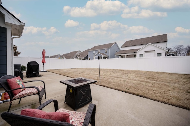 view of patio / terrace featuring area for grilling and a fire pit