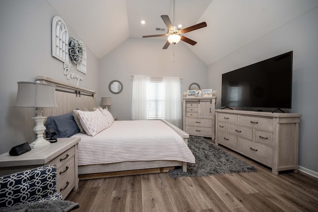 bedroom featuring ceiling fan, high vaulted ceiling, and hardwood / wood-style floors