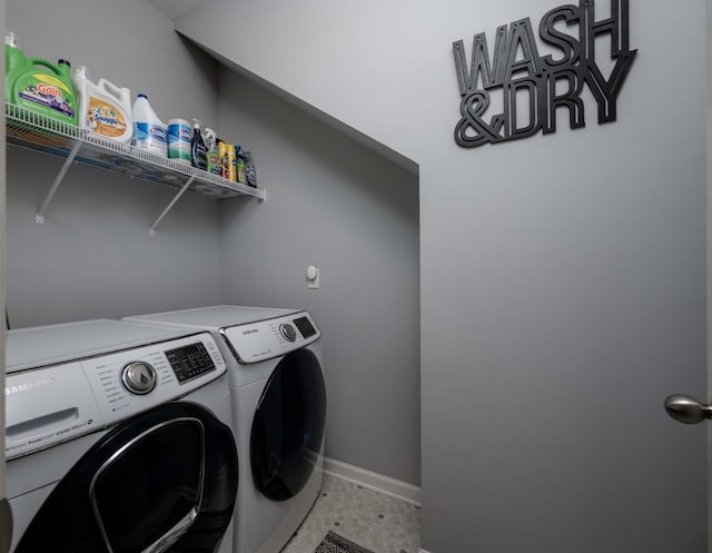 washroom featuring washer and clothes dryer