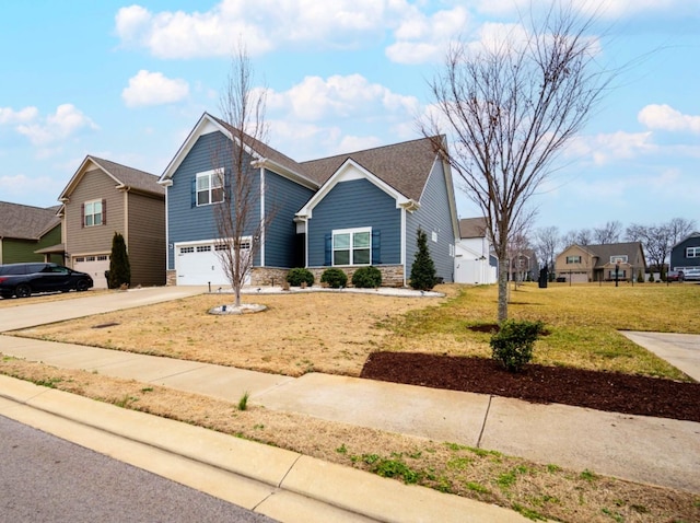 view of front facade featuring a garage and a front yard