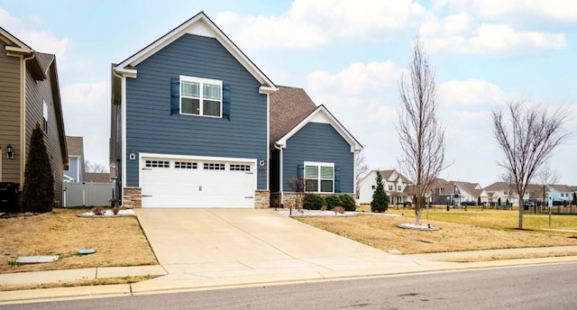 view of front facade with a garage and a front yard