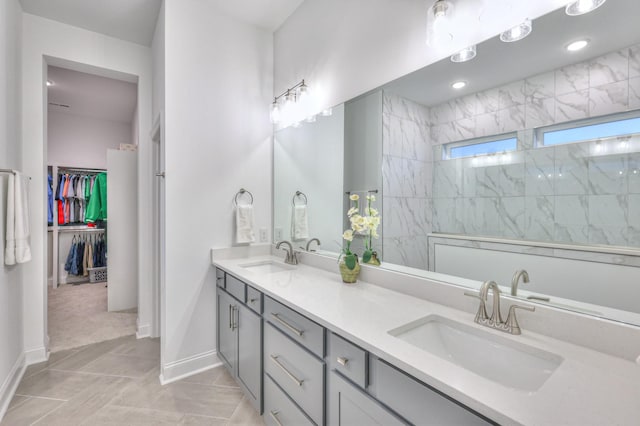 bathroom featuring vanity and tiled shower