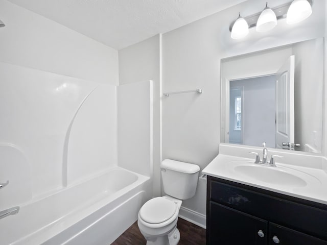 full bathroom featuring shower / tub combination, vanity, hardwood / wood-style flooring, and toilet