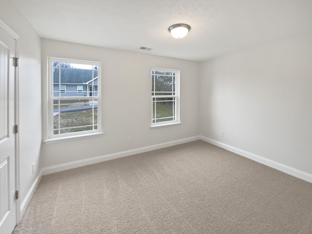 unfurnished room featuring carpet flooring